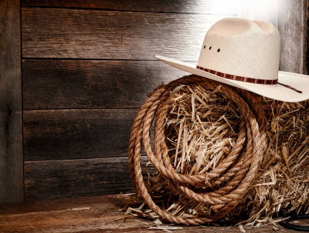 White Cowboy Hat On A Hay Bale