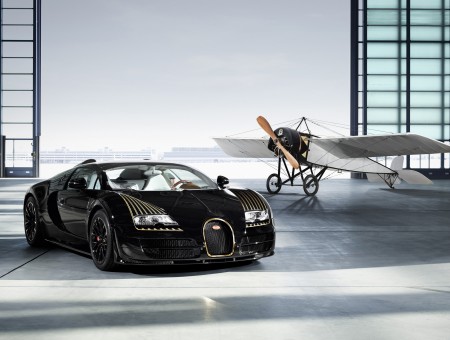 Black Bugatti Chiron Next To Plane During Daytime