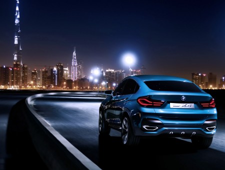 Blue BMW Sedan Car During Nighttime