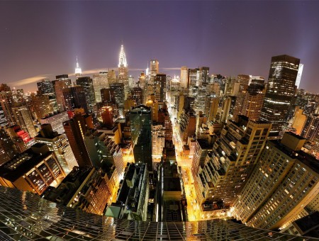 Aerial View Of City Buildings With  Lights During Night Time