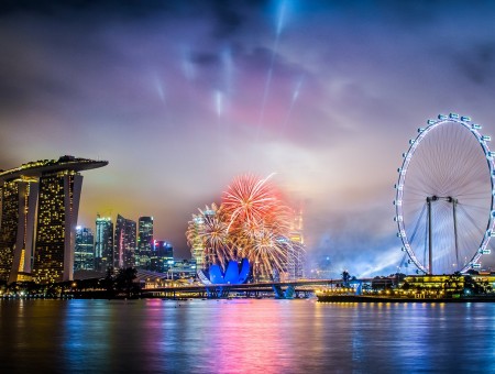 Fireworks Brocade Between London Eye And Marina Bay Sands