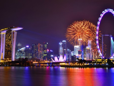 City Skyline With Fireworks During Night Time