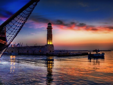 Lighthouse Near Sea During Sunset