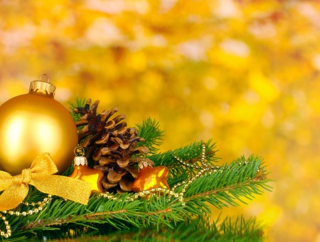 Yellow Christmas Tree Ball Near Pinecone