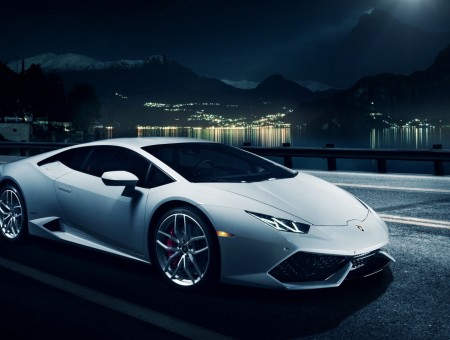 White Sports Car On Black Road During Nighttime