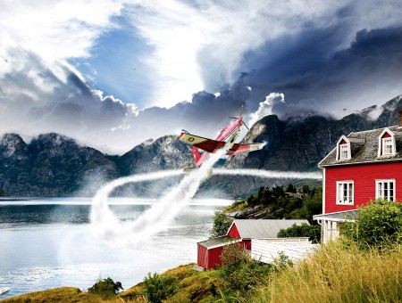 Red House Near At Lake With Flying Airplane Portrait