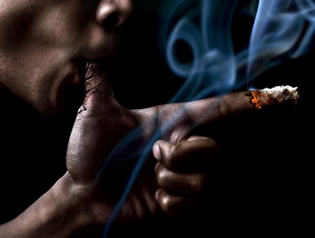 Man Smoking Using Thumb And Index Finger Burning Photo