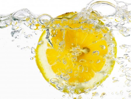 Yellow Lemon In Clear Water