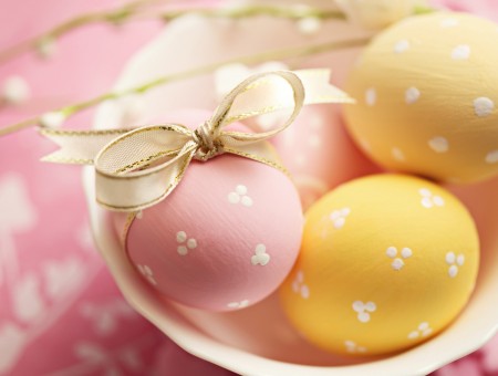 Pink And Yellow Decorative Eggs On White Bowl