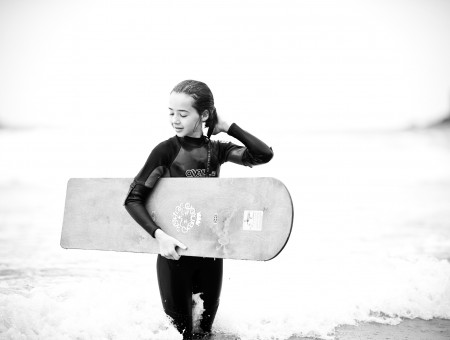 Girl Wearing Diving Suit Holding Skim Board