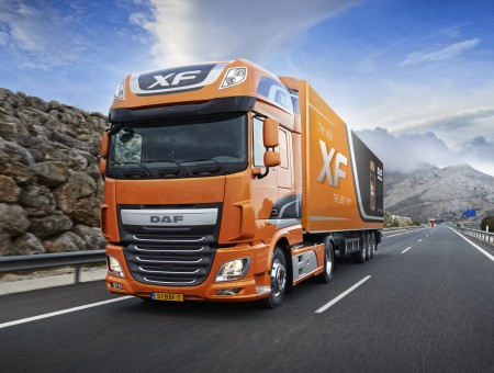 Orange And Black Daf Freight Truck On Road