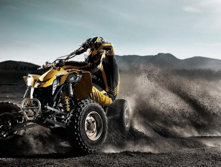Yellow and black all terrain vehicle
