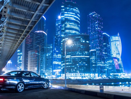 Cityscape and blue car