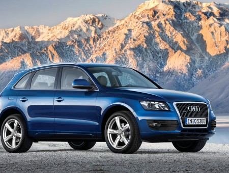 SUV Audi on the background of mountains