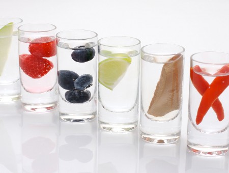 Different food in glasses with water