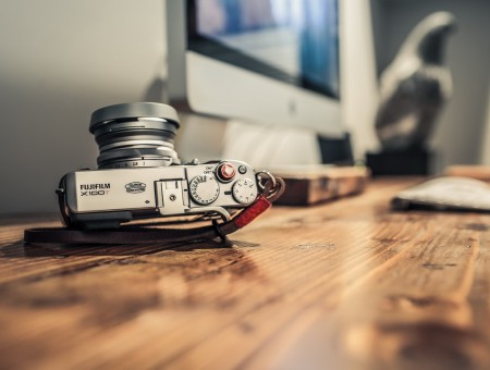 A retro camera lies on a table