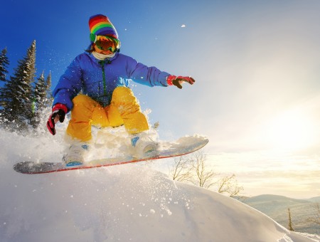 Snowboarder among the snow slopes