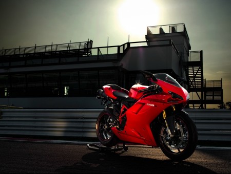 Red racing bike on the track