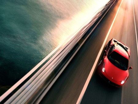 Red Ferrari Spyder on road
