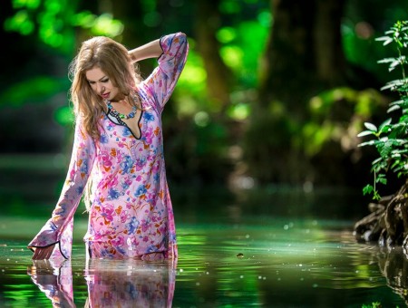 Beautiful girl in swamp