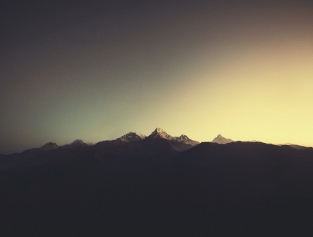 Dawn on dark mountains