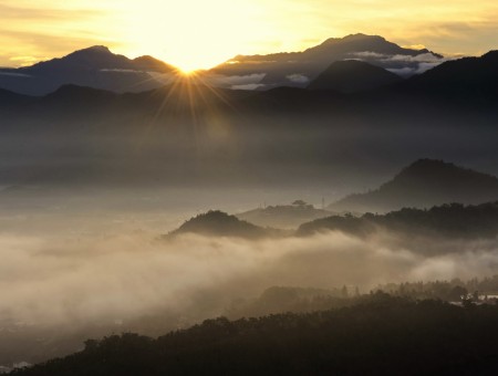Dawn on fog mountains