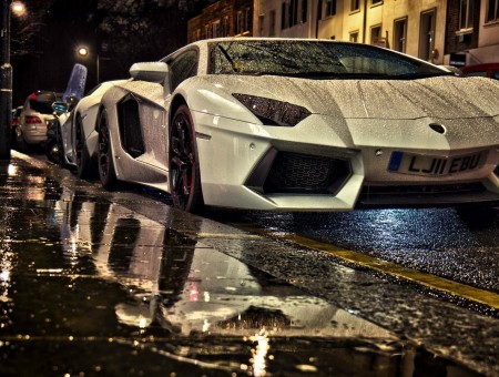 white lambo with drops in the street
