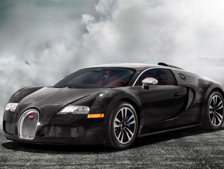 black buggati on the road with clouds