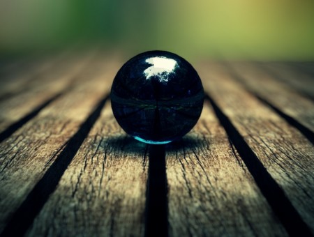glass ball on wood