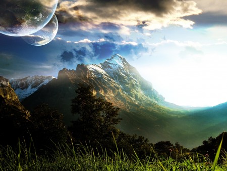 mountains and two planets in sky