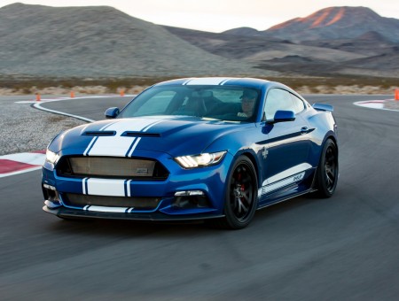 blue ford shelby on the road
