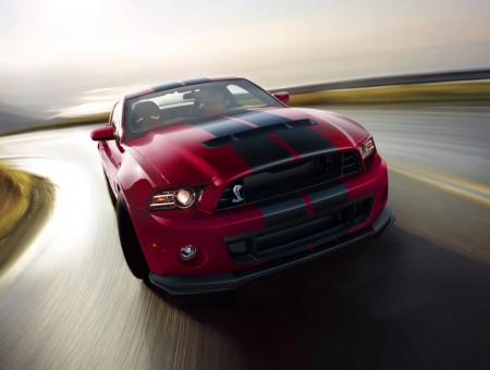 Red ford shelby on road