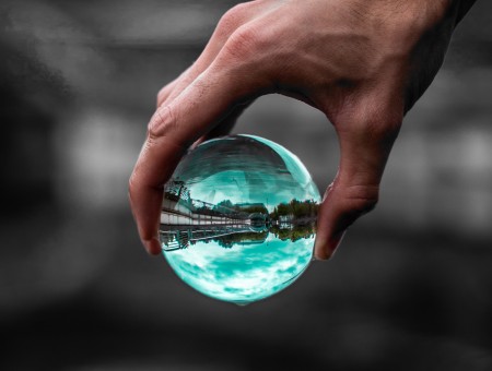 Glass ball in hand