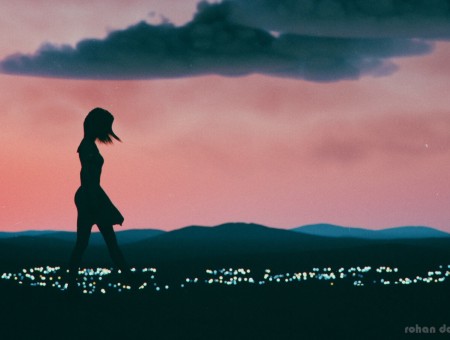 Girl silhouette on horizon background