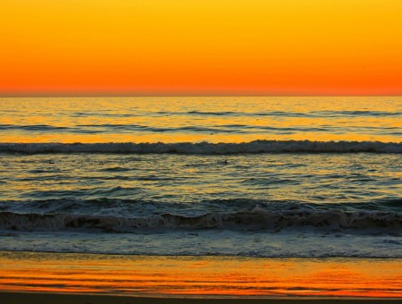 Sea surf on sunset background